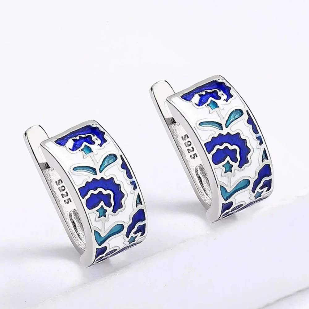 Sterling silver earrings with blue acrylic accents. - Picture 3 of 5
